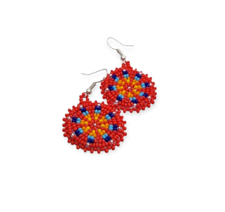 Red Handmade Beaded Earrings for women featuring vibrant native-style beadwork with multicolor accents in a bold boho medallion design. These statement festival earrings showcase intricate craftsmanship and colorful patterns, perfect for adding a pop of color to any outfit. Ideal gift for women who appreciate unique, artisanal jewelry with cultural significance. Lightweight and striking, these earrings elevate both casual and festive looks with artistic flair.