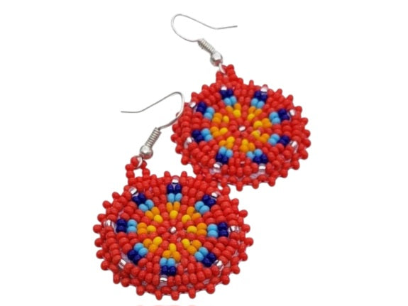 Red Handmade Beaded Earrings for women featuring vibrant native-style beadwork with multicolor accents in a bold boho medallion design. These statement festival earrings showcase intricate craftsmanship and colorful patterns, perfect for adding a pop of color to any outfit. Ideal gift for women who appreciate unique, artisanal jewelry with cultural significance. Lightweight and striking, these earrings elevate both casual and festive looks with artistic flair.