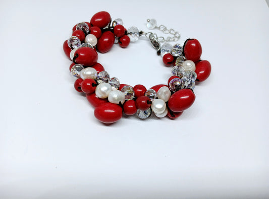 Magnesite Pearl Crystal Red Bracelet handcrafted with vibrant red crystals, white pearls, and magnesite stones for a bold, elegant look. This statement bracelet is perfect for girls and women, ideal as bridal jewelry or a thoughtful bridesmaid gift. The handmade design adds a touch of glamour to weddings, parties, or special occasions. A beautiful and meaningful accessory that makes a memorable gift for women who love colorful, unique jewelry.