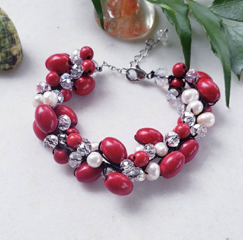 Magnesite Pearl Crystal Red Bracelet handcrafted with vibrant red crystals, white pearls, and magnesite stones for a bold, elegant look. This statement bracelet is perfect for girls and women, ideal as bridal jewelry or a thoughtful bridesmaid gift. The handmade design adds a touch of glamour to weddings, parties, or special occasions. A beautiful and meaningful accessory that makes a memorable gift for women who love colorful, unique jewelry.