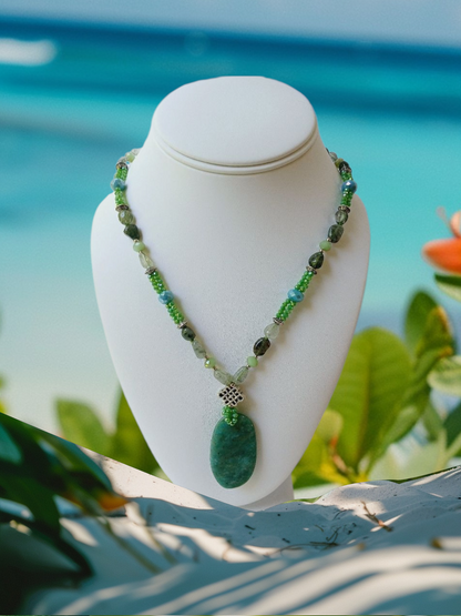 Amazonite, Jasper, and Quartz Multi-Stone Necklace featuring a unique Russian pendant design, handcrafted into a bold boho statement necklace for women. This green-toned jewelry piece blends natural gemstones to create a vibrant accessory full of healing energy and artistic charm. Perfect as a handmade gift for her, it adds a distinctive touch to any outfit, ideal for everyday wear or special occasions, combining artisanal craftsmanship with natural beauty.