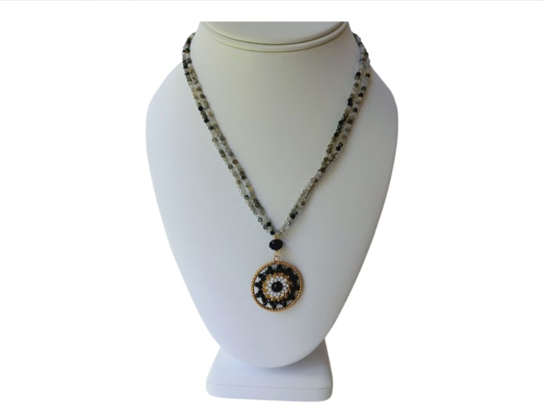 Quartz Medallion Pendant Necklace for women featuring a delicate handmade design with a sparkling crystal centerpiece and intricate beaded detailing. This boho-style statement jewelry piece combines elegance and artisanal craftsmanship, perfect for layering or wearing alone. Ideal gift for her on birthdays, holidays, or special occasions. Adds a touch of natural beauty and sophistication to casual or formal outfits with a timeless handmade charm.