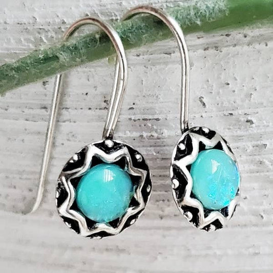 Azure Blue Opal Earrings crafted in sterling silver, featuring dainty minimalist drop design perfect for everyday wear. These boho-inspired turquoise jewelry pieces add a subtle pop of color and elegance, making them an ideal gift for her. Lightweight and versatile, the earrings complement casual and formal outfits alike. Handmade with care, they blend natural opal’s iridescent beauty with modern minimalist style for timeless charm.