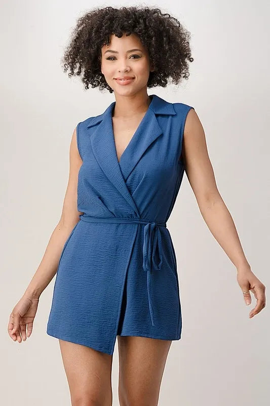 Sleeveless collar asymmetrical romper for women available in blue or red, crafted from 100% polyester fabric. This elegant one-piece outfit features a unique asymmetrical design that adds a modern touch to summer casual and party wear. Lightweight and breathable, it offers comfort and style for warm weather occasions. Perfect for daytime outings or evening events, this versatile romper blends sophistication with effortless fashion.