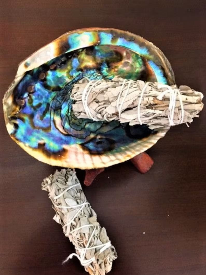 Complete smudging kit featuring California white sage bundles and a natural abalone shell, designed for spiritual cleansing and purification rituals. This handcrafted set is perfect for housewarming gifts or personal wellness practices, helping to clear negative energy and promote positive vibes. Ideal for those who practice smudging ceremonies, meditation, or energy healing, combining traditional elements in a beautiful, easy-to-use ritual kit.