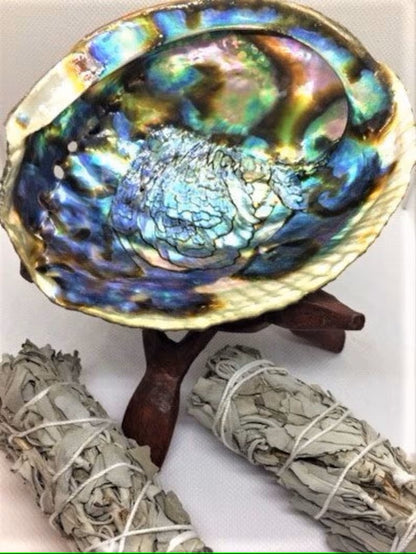 Complete smudging kit featuring California white sage bundles and a natural abalone shell, designed for spiritual cleansing and purification rituals. This handcrafted set is perfect for housewarming gifts or personal wellness practices, helping to clear negative energy and promote positive vibes. Ideal for those who practice smudging ceremonies, meditation, or energy healing, combining traditional elements in a beautiful, easy-to-use ritual kit.