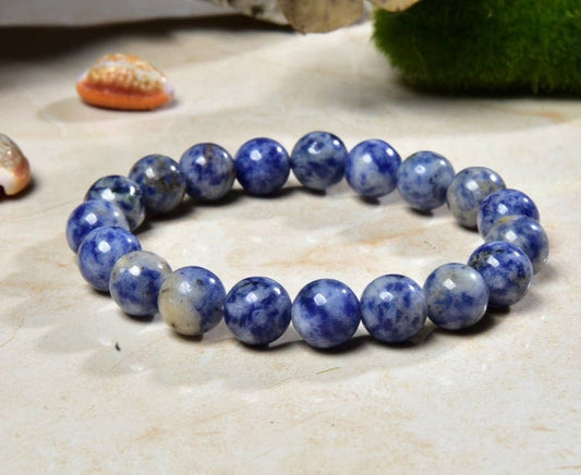 Handmade Sodalite Bracelet featuring natural healing crystals, designed as a mala bead chakra bracelet for meditation and spiritual balance. This Dumortierite-infused jewelry piece promotes calm, clarity, and emotional healing, suitable for both men and women. Perfect as a meaningful gift for mindfulness practitioners, yoga lovers, or anyone seeking positive energy. Stylish, durable, and crafted with care for everyday wear or meditation sessions.