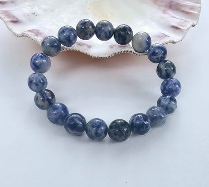 Handmade Sodalite Bracelet featuring natural healing crystals, designed as a mala bead chakra bracelet for meditation and spiritual balance. This Dumortierite-infused jewelry piece promotes calm, clarity, and emotional healing, suitable for both men and women. Perfect as a meaningful gift for mindfulness practitioners, yoga lovers, or anyone seeking positive energy. Stylish, durable, and crafted with care for everyday wear or meditation sessions.