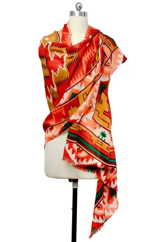 Southwestern print scarf for women featuring an oversized design with bold tribal and boho patterns. Made from soft, breathable viscose, this vibrant western-style shawl is perfect for fall and winter fashion. The rich, warm colors and intricate design make it a versatile wrap for chilly days, adding a statement to any outfit. Ideal for layering, this stylish scarf blends comfort, warmth, and bold seasonal style.