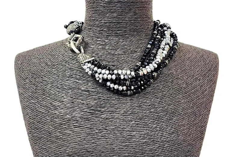 Black silver crystal torsade choker necklace featuring chunky, bold crystals for a striking statement look. Designed for women who want glamorous evening jewelry, this elegant choker adds sparkle and sophistication to any outfit. Perfect as a gift for her, it combines modern style with timeless glam. Ideal for special occasions, parties, or formal events, this crystal necklace delivers eye-catching allure and confident, bold fashion.