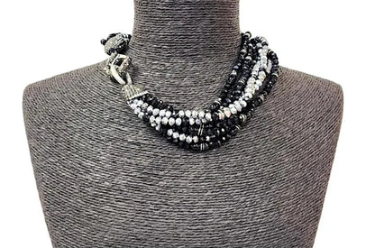 Black silver crystal torsade choker necklace featuring chunky, bold crystals for a striking statement look. Designed for women who want glamorous evening jewelry, this elegant choker adds sparkle and sophistication to any outfit. Perfect as a gift for her, it combines modern style with timeless glam. Ideal for special occasions, parties, or formal events, this crystal necklace delivers eye-catching allure and confident, bold fashion.