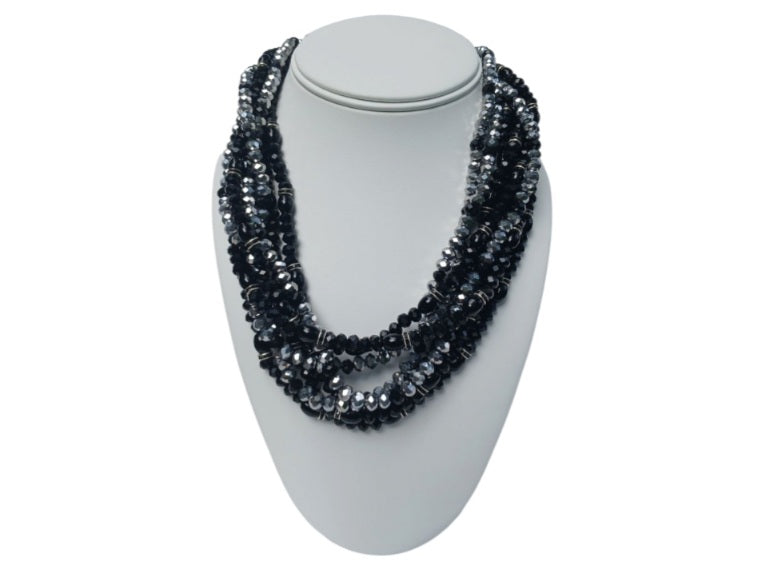 Black silver crystal torsade choker necklace featuring chunky, bold crystals for a striking statement look. Designed for women who want glamorous evening jewelry, this elegant choker adds sparkle and sophistication to any outfit. Perfect as a gift for her, it combines modern style with timeless glam. Ideal for special occasions, parties, or formal events, this crystal necklace delivers eye-catching allure and confident, bold fashion.