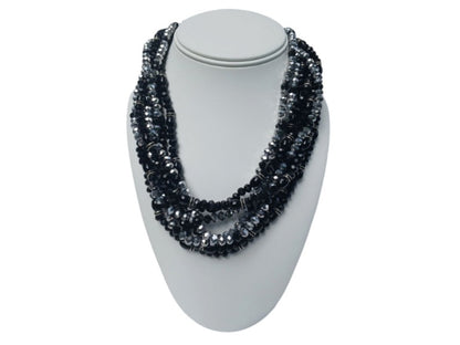 Black silver crystal torsade choker necklace featuring chunky, bold crystals for a striking statement look. Designed for women who want glamorous evening jewelry, this elegant choker adds sparkle and sophistication to any outfit. Perfect as a gift for her, it combines modern style with timeless glam. Ideal for special occasions, parties, or formal events, this crystal necklace delivers eye-catching allure and confident, bold fashion.