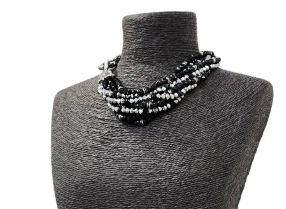 Black silver crystal torsade choker necklace featuring chunky, bold crystals for a striking statement look. Designed for women who want glamorous evening jewelry, this elegant choker adds sparkle and sophistication to any outfit. Perfect as a gift for her, it combines modern style with timeless glam. Ideal for special occasions, parties, or formal events, this crystal necklace delivers eye-catching allure and confident, bold fashion.