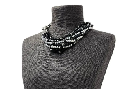 Black silver crystal torsade choker necklace featuring chunky, bold crystals for a striking statement look. Designed for women who want glamorous evening jewelry, this elegant choker adds sparkle and sophistication to any outfit. Perfect as a gift for her, it combines modern style with timeless glam. Ideal for special occasions, parties, or formal events, this crystal necklace delivers eye-catching allure and confident, bold fashion.