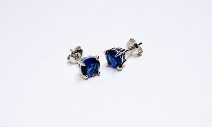 Blue Sapphire Sterling Silver Stud Earrings featuring dazzling deep blue gemstones in a minimalist setting. These elegant birthstone earrings are perfect for women who love dainty, timeless jewelry with meaningful detail. Ideal as a September birthday or anniversary gift, they offer a refined, sophisticated touch for everyday wear or special occasions.Handcrafted with care, these studs make a thoughtful gift for her, blending simplicity, elegance, and personal significance in one classic design.