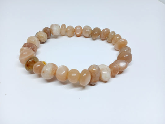 Genuine Sunstone Nugget Stretch Bracelet featuring handmade crystal beads designed for women who appreciate natural healing gemstone jewelry. This artisanal sunstone bracelet showcases radiant orange hues symbolizing positivity and energy. Lightweight and comfortable, it makes a thoughtful gift for her, perfect for spiritual wellness or everyday wear. Combining vibrant sunstone nuggets with stretchy design, this bracelet blends style, healing properties, and handcrafted elegance.