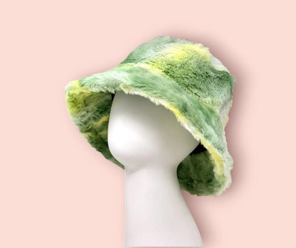 Tie Dye Handmade Green Watercolor Faux Fur Bucket Hat featuring a soft, plush texture and warm design perfect for fall and cooler seasons. This trendy unisex hat for men and women showcases a unique green watercolor-inspired tie dye pattern that adds bold, artistic flair to any outfit. Cozy and eye-catching, it’s ideal for casual wear, festivals, or outdoor adventures. A stylish statement piece and thoughtful gift for fashion-forward individuals.