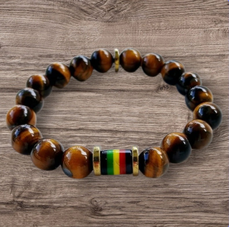 Tiger Eye Bracelet for men featuring a handmade design inspired by Rastafarian and reggae culture, crafted to promote protection, prosperity, and strength. This lucky mantra jewelry combines earthy Tiger Eye beads with bold, vibrant accents for a spiritual yet stylish look. Perfect for daily wear or meaningful gifting, it’s ideal for those seeking grounding energy and cultural expression. A powerful accessory with deep symbolism and unique design.