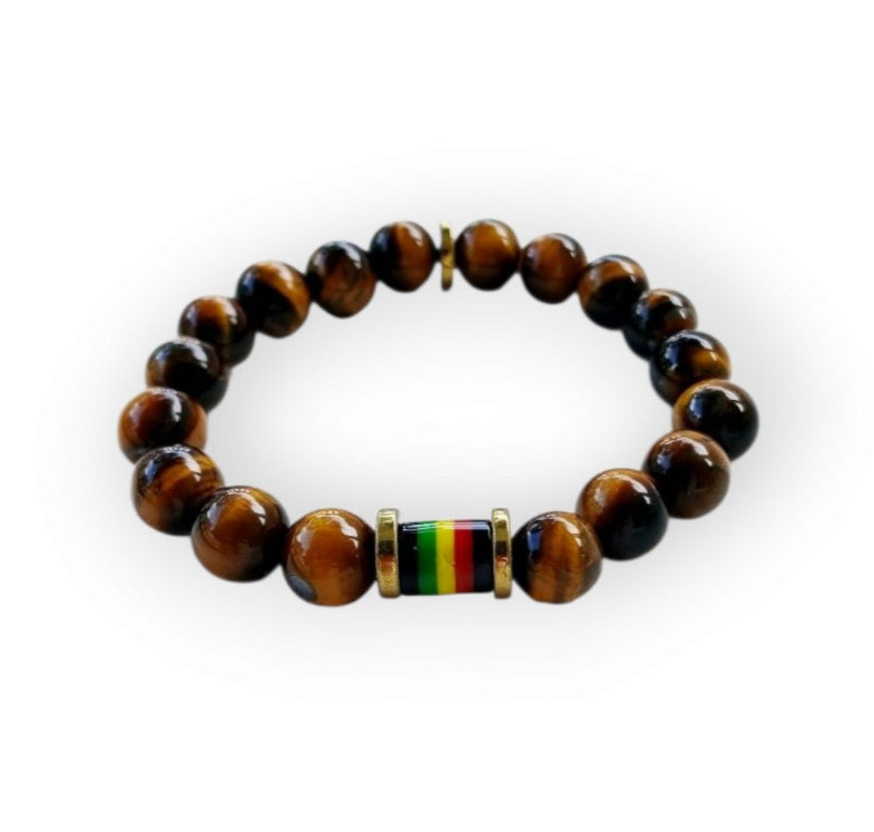 Tiger Eye Bracelet for men featuring a handmade design inspired by Rastafarian and reggae culture, crafted to promote protection, prosperity, and strength. This lucky mantra jewelry combines earthy Tiger Eye beads with bold, vibrant accents for a spiritual yet stylish look. Perfect for daily wear or meaningful gifting, it’s ideal for those seeking grounding energy and cultural expression. A powerful accessory with deep symbolism and unique design.