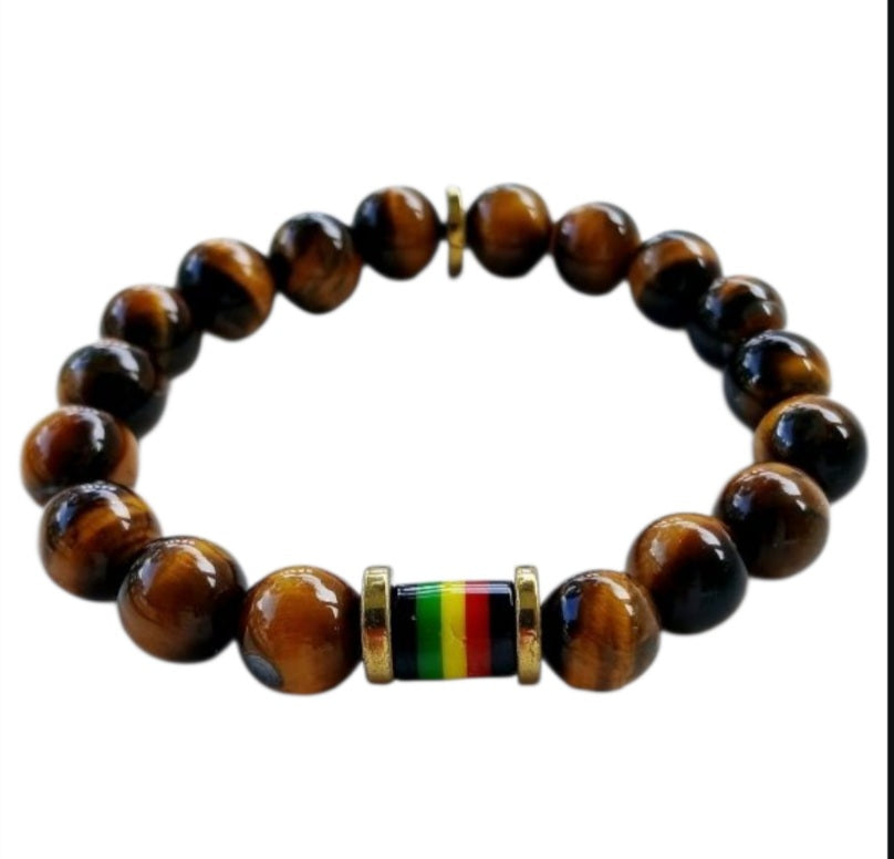 Tiger Eye Bracelet for men featuring a handmade design inspired by Rastafarian and reggae culture, crafted to promote protection, prosperity, and strength. This lucky mantra jewelry combines earthy Tiger Eye beads with bold, vibrant accents for a spiritual yet stylish look. Perfect for daily wear or meaningful gifting, it’s ideal for those seeking grounding energy and cultural expression. A powerful accessory with deep symbolism and unique design.