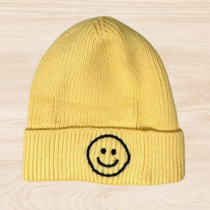 Trendy smiley face beanie hat made from cozy knit fabric, perfect for kids, teens, and adults. This fun and stylish hat adds warmth and personality to any fall, winter, or spring outfit. With its cheerful embroidered design, it’s a great gift idea and a playful accessory for all ages. Comfortable and eye-catching, this knit beanie offers both fashion and function, keeping you warm while spreading positive vibes in cooler weather.
