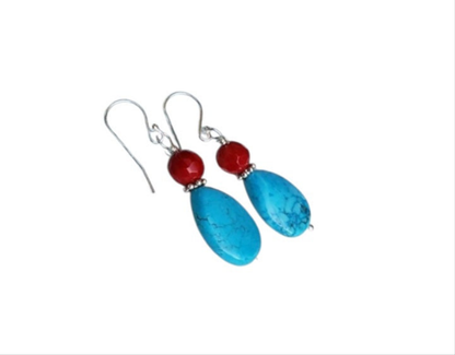 Turquoise and Red Coral Sterling Silver Earrings featuring a handmade water drop design crafted for women who love bold, natural gemstone jewelry. These unique earrings combine vibrant turquoise and rich red coral with elegant sterling silver accents, creating a striking boho-chic accessory. Perfect as a thoughtful gift, they offer a pop of color and artisan charm, ideal for everyday wear or special occasions. Lightweight and eye-catching with timeless appeal.