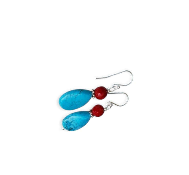 Turquoise and Red Coral Sterling Silver Earrings featuring a handmade water drop design crafted for women who love bold, natural gemstone jewelry. These unique earrings combine vibrant turquoise and rich red coral with elegant sterling silver accents, creating a striking boho-chic accessory. Perfect as a thoughtful gift, they offer a pop of color and artisan charm, ideal for everyday wear or special occasions. Lightweight and eye-catching with timeless appeal.
