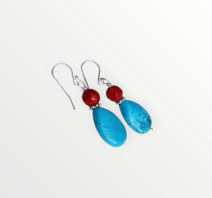 Turquoise and Red Coral Sterling Silver Earrings featuring a handmade water drop design crafted for women who love bold, natural gemstone jewelry. These unique earrings combine vibrant turquoise and rich red coral with elegant sterling silver accents, creating a striking boho-chic accessory. Perfect as a thoughtful gift, they offer a pop of color and artisan charm, ideal for everyday wear or special occasions. Lightweight and eye-catching with timeless appeal.