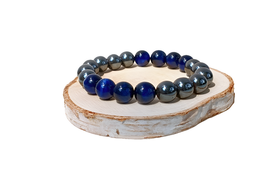 Blue Tiger Eye Hematite Bracelet handcrafted with natural stones including lapis lazuli, polished hematite, and deep blue tiger eye. This unisex stretch bracelet blends style and energy, offering grounding, focus, and protection. A perfect lucky charm and thoughtful gift for men or women, ideal for daily wear or spiritual practice. Handmade with care, this natural stone bracelet is a unique accessory for those who value wellness and intentional living.