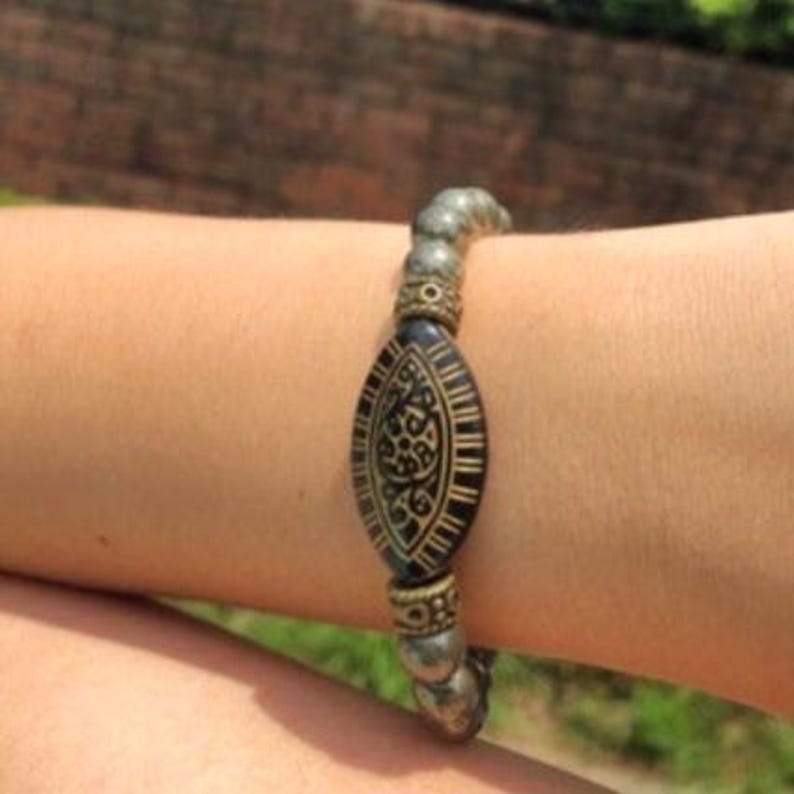 Pyrite Bracelet with 8mm handmade beaded crystals, designed to promote abundance, good luck, and positive spiritual energy. This unisex bracelet combines shimmering pyrite stones crafted into a stylish accessory for both women and men. Perfect as a meaningful gift, it supports confidence, prosperity, and protection. Lightweight and versatile, this abundance bracelet blends healing properties with elegant, handmade jewelry for everyday wear or special occasions.