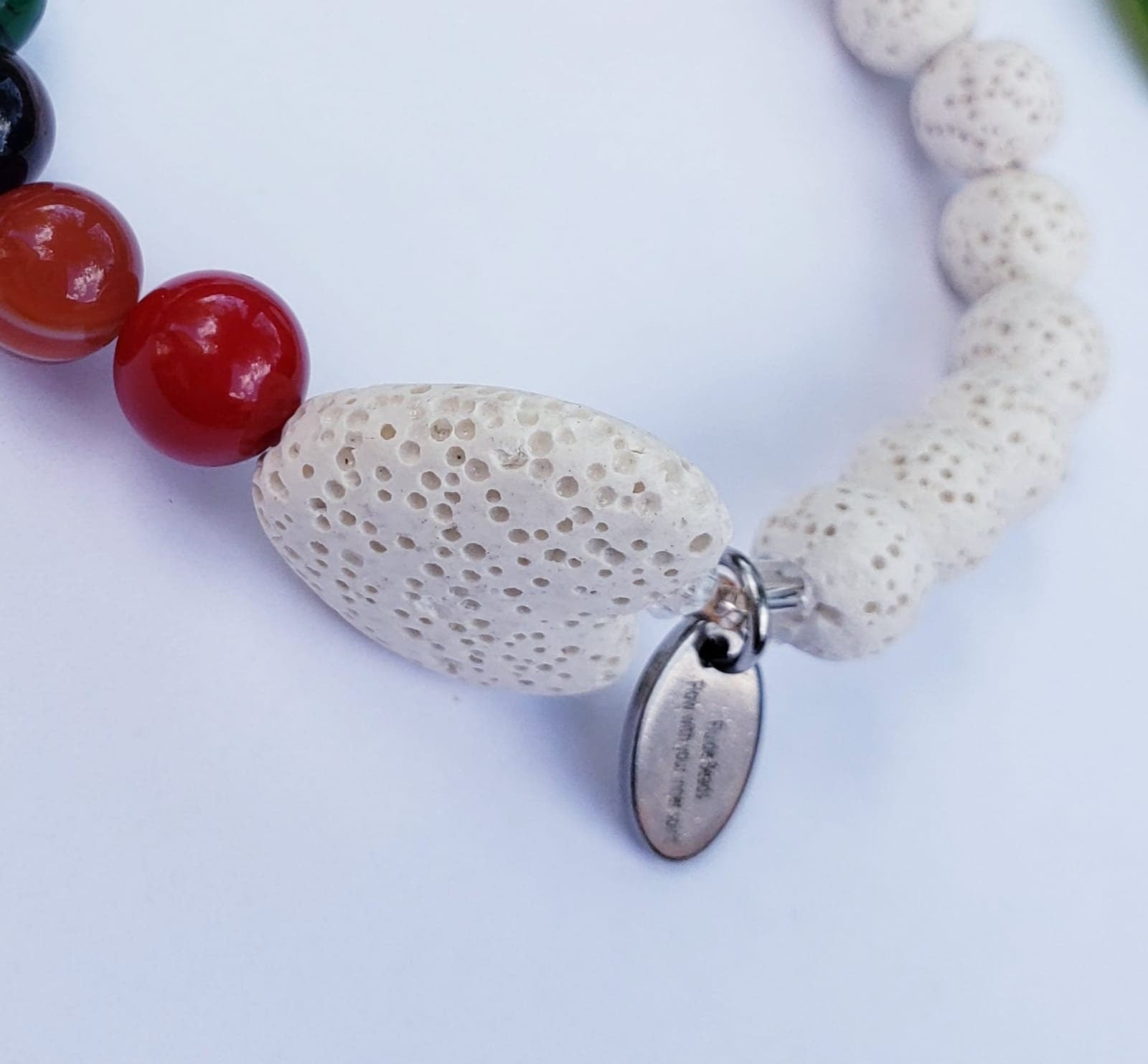 Handmade white lava stone diffuser bracelet designed for women, featuring natural volcanic stones known for their healing and chakra balancing properties. This stretch bracelet combines crystal healing benefits with stylish, lightweight comfort, perfect for everyday wear or meditation practices. Ideal as a thoughtful gift, it allows essential oils to be diffused throughout the day, blending wellness with elegant, natural jewelry design.