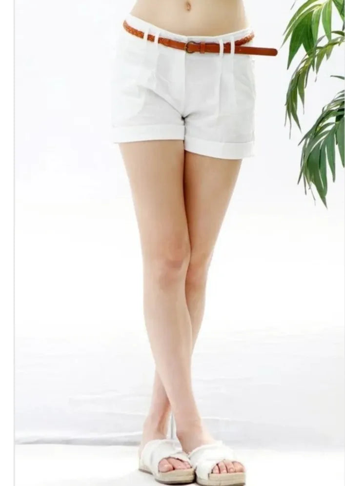 Linen shorts for women featuring side pockets and a twist belt design for added style and functionality. These lightweight short shorts are perfect for casual summer and beachwear, offering breathable fabric that keeps you cool and comfortable in warm weather. Designed for a relaxed fit, they combine practicality and fashion, making them an ideal choice for everyday wear, vacations, or outdoor activities during sunny days.