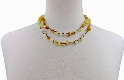 Yellow Jade Beaded Necklace featuring long strands of vibrant yellow jade stones, crafted into a vintage-inspired handmade statement necklace. This bold accessory blends classic elegance with artisanal craftsmanship, perfect for women who love unique, eye-catching jewelry. Ideal gift for special occasions or everyday wear, adding warmth and color to any outfit. A timeless, handcrafted piece that complements both casual and formal styles with boho-chic flair.