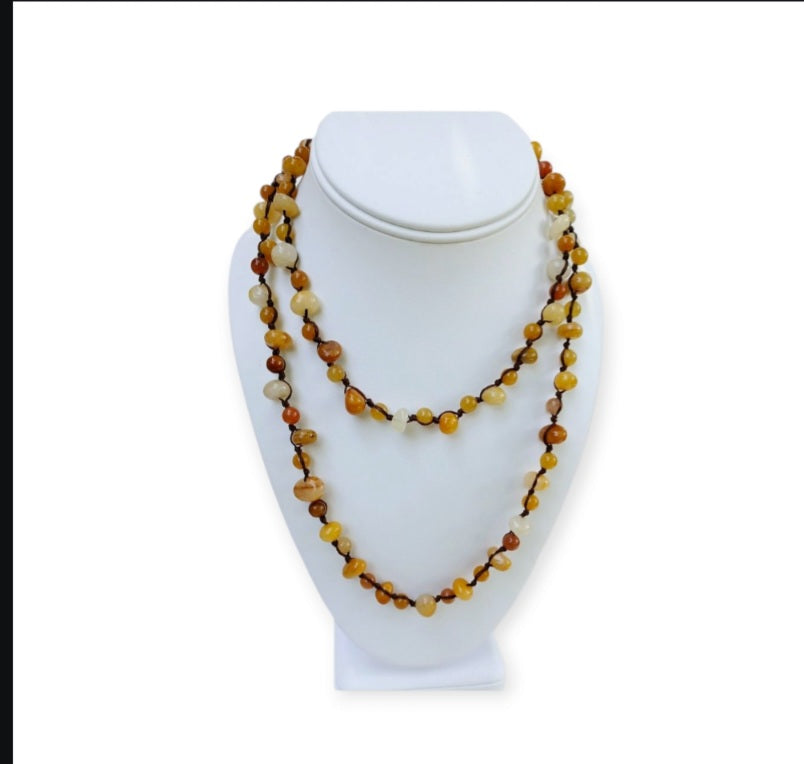 Yellow Jade Beaded Necklace featuring long strands of vibrant yellow jade stones, crafted into a vintage-inspired handmade statement necklace. This bold accessory blends classic elegance with artisanal craftsmanship, perfect for women who love unique, eye-catching jewelry. Ideal gift for special occasions or everyday wear, adding warmth and color to any outfit. A timeless, handcrafted piece that complements both casual and formal styles with boho-chic flair.