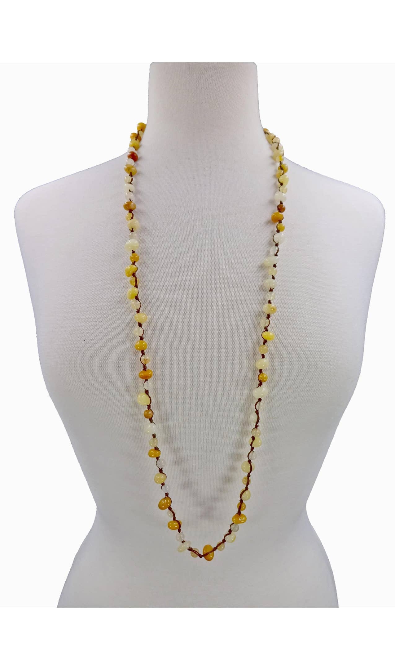 Yellow Jade Beaded Necklace featuring long strands of vibrant yellow jade stones, crafted into a vintage-inspired handmade statement necklace. This bold accessory blends classic elegance with artisanal craftsmanship, perfect for women who love unique, eye-catching jewelry. Ideal gift for special occasions or everyday wear, adding warmth and color to any outfit. A timeless, handcrafted piece that complements both casual and formal styles with boho-chic flair.