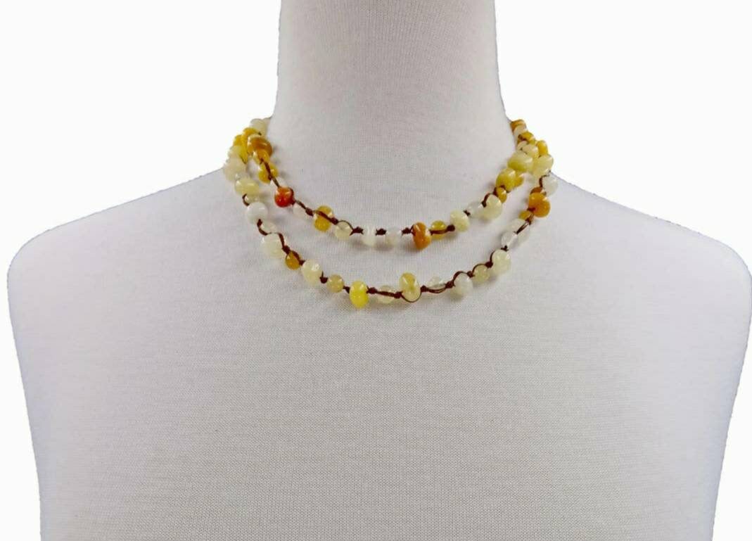 Yellow Jade Beaded Necklace featuring long strands of vibrant yellow jade stones, crafted into a vintage-inspired handmade statement necklace. This bold accessory blends classic elegance with artisanal craftsmanship, perfect for women who love unique, eye-catching jewelry. Ideal gift for special occasions or everyday wear, adding warmth and color to any outfit. A timeless, handcrafted piece that complements both casual and formal styles with boho-chic flair.