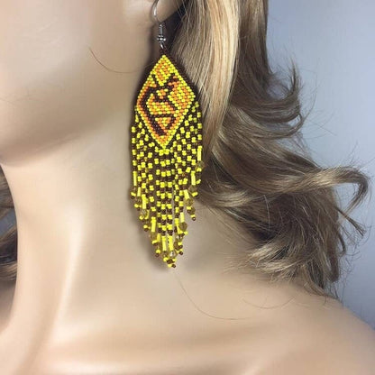 Handmade Yellow Beaded Earrings featuring large Kokopelli designs crafted in boho sterling silver jewelry style. These statement earrings for women showcase vibrant yellow beads combined with intricate Kokopelli motifs, perfect for adding bold, artistic flair to any outfit. Ideal as a unique gift for her, they blend cultural symbolism with trendy, handcrafted elegance. Lightweight and durable, these earrings are perfect for festivals, casual wear, or special occasions.